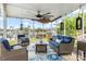Covered patio area with comfortable seating and a view of the canal at 1301 Appian Dr, Punta Gorda, FL 33950