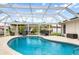 Screened in pool area with ample room for outdoor seating and grilling at 1301 Appian Dr, Punta Gorda, FL 33950