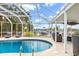 Screened in pool area with a view of the canal at 1301 Appian Dr, Punta Gorda, FL 33950