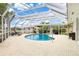Screened-in pool featuring plenty of seating and views of the canal at 1301 Appian Dr, Punta Gorda, FL 33950