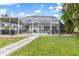 Screened in pool area in a well maintained backyard at 1301 Appian Dr, Punta Gorda, FL 33950
