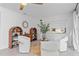 Bright sitting area with two shelves, a round mirror, and a view of the front yard at 1301 Appian Dr, Punta Gorda, FL 33950