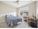 Neutral bedroom featuring carpet, a ceiling fan, a desk, and a queen size bed with a window at 1456 Neapolitan Rd, Punta Gorda, FL 33983