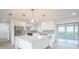 Bright kitchen with white cabinets, quartz countertops, and stainless steel appliances at 18098 Petoskey Cir, Port Charlotte, FL 33948