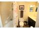 A full bathroom featuring a tub/shower, and dark vanity with light colored walls at 2000 Forrest Nelson Blvd # B4, Port Charlotte, FL 33952