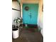 A welcoming blue double door entrance is decorated with plants and a wreath at 21363 Cottonwood Ave, Port Charlotte, FL 33952