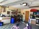 Organized garage featuring shelving units, work benches, and space for storage and hobbies at 21363 Cottonwood Ave, Port Charlotte, FL 33952