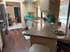 Kitchen with granite counters, white cabinets, stainless steel appliances, and views of pool area at 21363 Cottonwood Ave, Port Charlotte, FL 33952