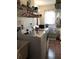 Well-lit laundry room with a washer, dryer, utility sink and shelving at 21363 Cottonwood Ave, Port Charlotte, FL 33952