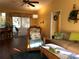Living room featuring comfortable seating, natural light and a view of the back patio at 21363 Cottonwood Ave, Port Charlotte, FL 33952