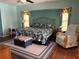 The main bedroom includes a large bed and is well-lit by natural light at 21363 Cottonwood Ave, Port Charlotte, FL 33952