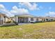 A spacious backyard with a screened patio area, ideal for outdoor entertaining and relaxation at 25120 E Lenox Cir, Punta Gorda, FL 33950