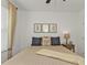 Serene bedroom featuring a comfortable bed, side table and natural light at 25120 E Lenox Cir, Punta Gorda, FL 33950