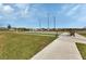 Well-maintained bocce ball courts with seating and landscaping in a serene community setting at 25120 E Lenox Cir, Punta Gorda, FL 33950