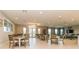 Clubhouse dining room with tables, chairs, and tiled flooring at 25120 E Lenox Cir, Punta Gorda, FL 33950
