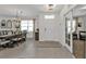 Inviting entryway featuring neutral tile flooring and a view into the dining and living areas at 25120 E Lenox Cir, Punta Gorda, FL 33950