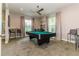 Recreation space with a billiard table, high-top tables, bar stools and natural light at 25120 E Lenox Cir, Punta Gorda, FL 33950