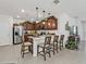 Stylish eat-in kitchen boasting stainless steel appliances, light countertops, and custom cabinetry at 25120 E Lenox Cir, Punta Gorda, FL 33950