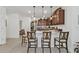 Modern kitchen featuring a breakfast bar, stainless steel appliances, and ample cabinet space at 25120 E Lenox Cir, Punta Gorda, FL 33950