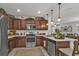 Charming kitchen featuring stainless appliances, wood cabinets, and decorative backsplash at 25120 E Lenox Cir, Punta Gorda, FL 33950
