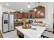 Well-appointed kitchen with quartz counters, stainless steel appliances, and decorative accents at 25120 E Lenox Cir, Punta Gorda, FL 33950