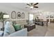 Bright living room and dining area featuring neutral tones, modern decor, and ample natural light at 25120 E Lenox Cir, Punta Gorda, FL 33950