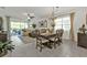 Open-concept living room with natural light and modern furnishings, great for entertaining at 25120 E Lenox Cir, Punta Gorda, FL 33950