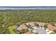 Community aerial view with mature trees surrounding single-Gathering homes at 2892 Myakka Creek Ct, Port Charlotte, FL 33953