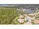 Wide aerial view of the community near a pond and mature trees at 2892 Myakka Creek Ct, Port Charlotte, FL 33953