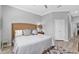 Comfortable bedroom features a king-size bed, stylish rug, and ample natural light at 2892 Myakka Creek Ct, Port Charlotte, FL 33953