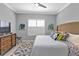 Cozy bedroom featuring neutral tones, a ceiling fan, and a decorative area rug at 2892 Myakka Creek Ct, Port Charlotte, FL 33953