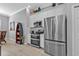 Beautiful stainless steel appliances in white kitchen, with view into the living area at 2892 Myakka Creek Ct, Port Charlotte, FL 33953