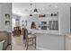 Bright, open kitchen featuring stainless appliances, a large marble countertop island with barstool seating, and pendant lighting at 2892 Myakka Creek Ct, Port Charlotte, FL 33953