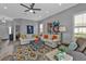Inviting living room with colorful rug, stylish furniture, and a relaxing ambiance for entertaining or unwinding at 2892 Myakka Creek Ct, Port Charlotte, FL 33953