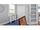 Bright home office with plantation shutters, ceiling fan and neutral paint on the walls and a blue rug on the floor at 2892 Myakka Creek Ct, Port Charlotte, FL 33953