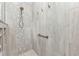 Walk-in shower with light tile surround, a mosaic accent stripe, and brushed nickel fixtures at 2892 Myakka Creek Ct, Port Charlotte, FL 33953