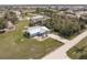 An aerial view of a single-story home with a metal roof, complemented by a lush green lawn at 3510 Amanda St, Punta Gorda, FL 33950