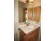 Well-maintained bathroom featuring a sink with a faucet and storage cabinets at 379 Bal Harbor Blvd, Punta Gorda, FL 33950