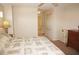 Bedroom featuring neutral tones, a large dresser, and an adjacent hallway visible from the doorway at 379 Bal Harbor Blvd, Punta Gorda, FL 33950