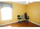 Bedroom with three rolling chairs, a ceiling fan, and a bright sunny window at 379 Bal Harbor Blvd, Punta Gorda, FL 33950