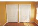 Bedroom features two white closets with lots of sunlight coming from the window at 379 Bal Harbor Blvd, Punta Gorda, FL 33950