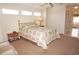 Comfortable bedroom with neutral carpet and a doorway to an en-suite bathroom at 379 Bal Harbor Blvd, Punta Gorda, FL 33950