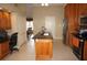 Eat-in kitchen with a large center island, wood cabinets, and stainless steel appliances at 379 Bal Harbor Blvd, Punta Gorda, FL 33950