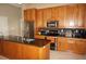 Beautiful kitchen with wood cabinetry, stainless steel appliances, and granite countertops at 379 Bal Harbor Blvd, Punta Gorda, FL 33950