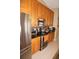 This kitchen features stainless steel appliances and warm wood cabinetry at 379 Bal Harbor Blvd, Punta Gorda, FL 33950