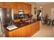 Spacious kitchen featuring stainless steel appliances, granite countertops, and wooden cabinetry at 379 Bal Harbor Blvd, Punta Gorda, FL 33950