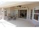 Inviting covered patio featuring a table and chairs, with an open doorway to the home's interior at 379 Bal Harbor Blvd, Punta Gorda, FL 33950