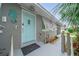 Welcoming entrance showcasing the front door, landscaping, and charming seaside decorations at 809 Kings Ct, Punta Gorda, FL 33950