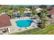 Relaxing community pool with lounge chairs and beautiful landscaping, perfect for enjoying the Florida sunshine at 8858 Tuscany Isles Dr, Punta Gorda, FL 33950