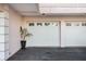 Attached garage with two-car white garage door at 908 Golden Beach Blvd # 201, Venice, FL 34285